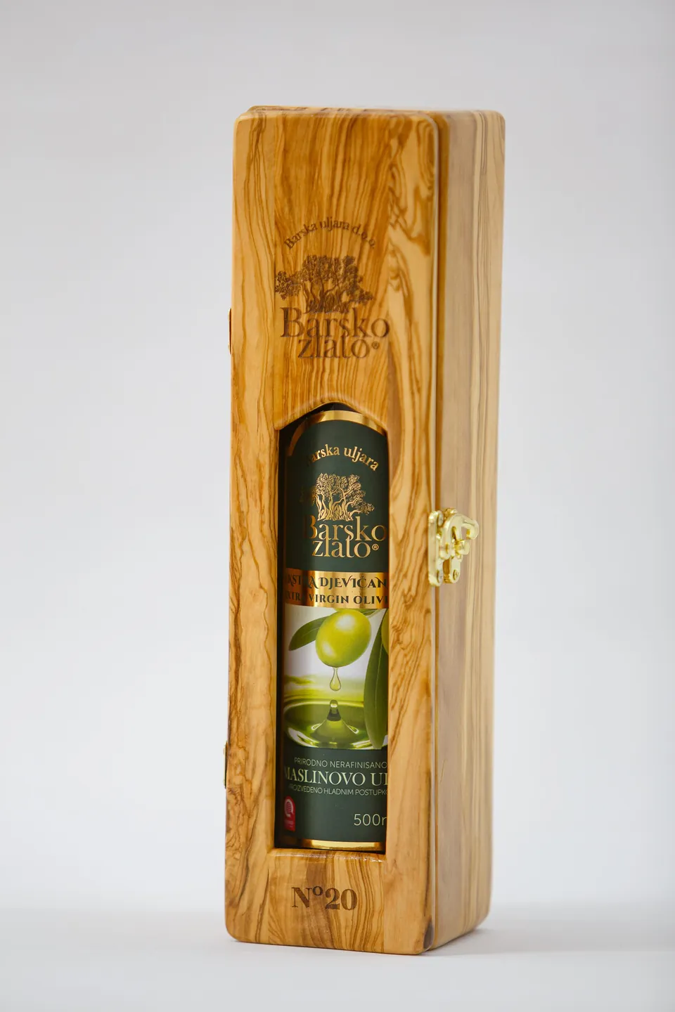 A 500 ml bottle of Barsko zlato extra virgin olive oil in its handmade olive wood box