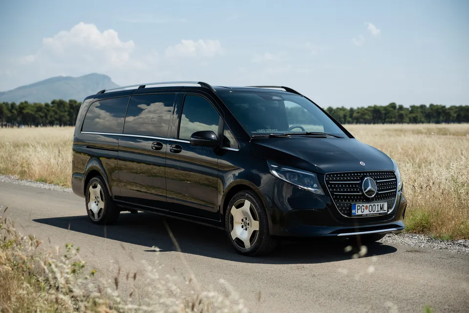 Black Mercedes V Class van parked on an open plain
