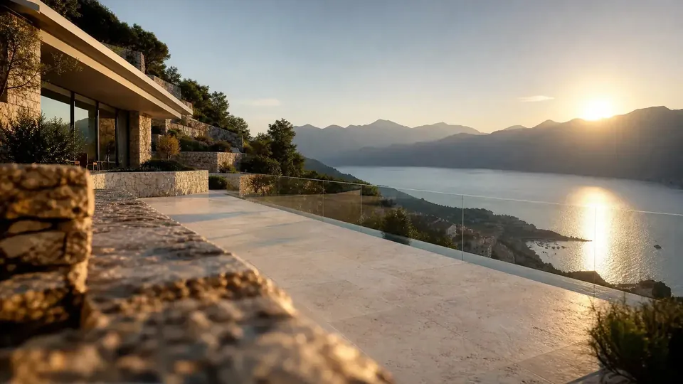 Stone terrace and infinity edge above the sea at sunset