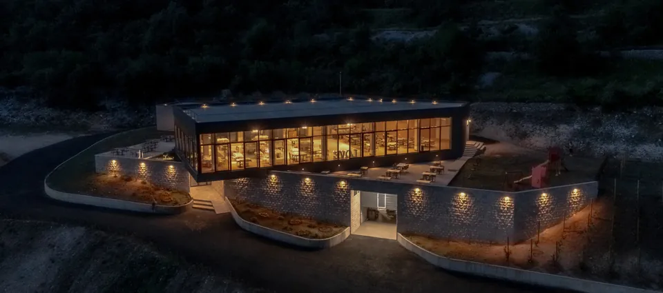 Winery building illuminated at night from above