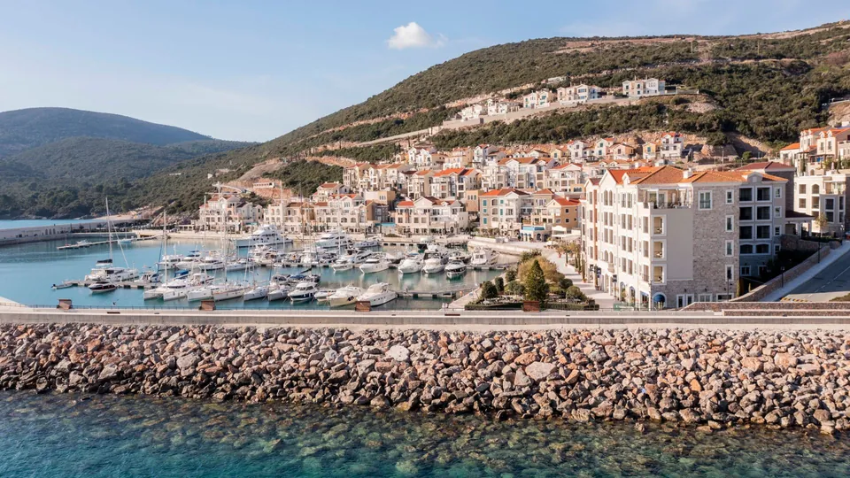 The marina and the town of Luštica Bay seen from the water