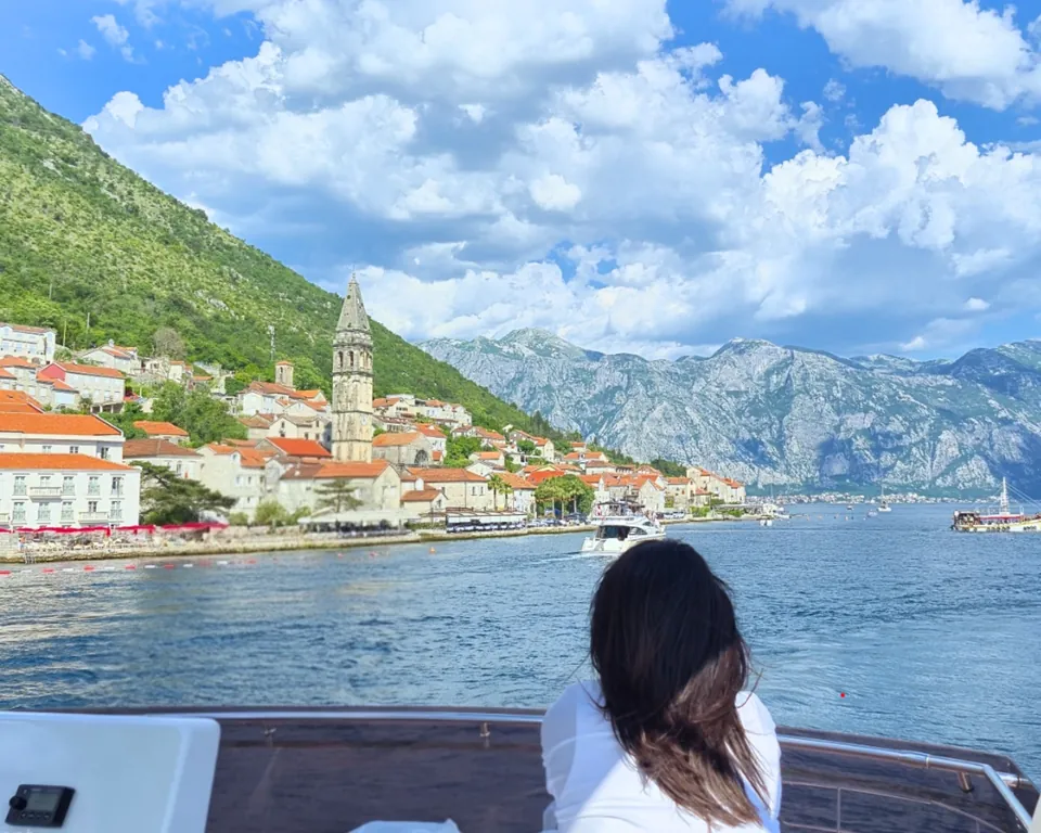 Perast church tower viewed from a boat deck in Boka Bay