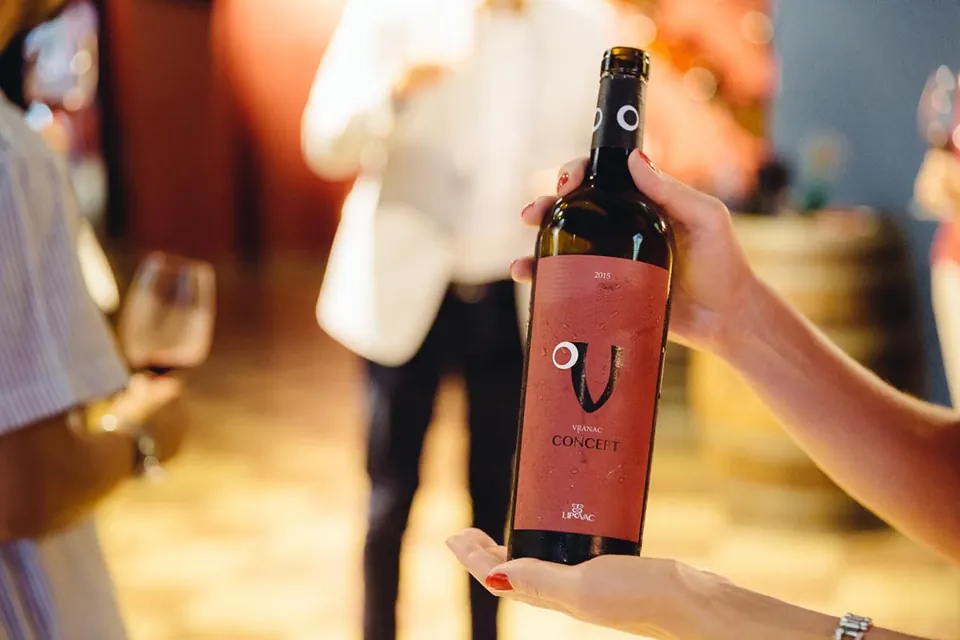 A Lipovac Vranac bottle held up at a tasting