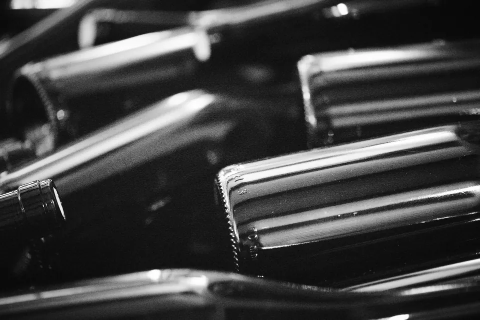 Wine bottles resting in the cellar in black and white